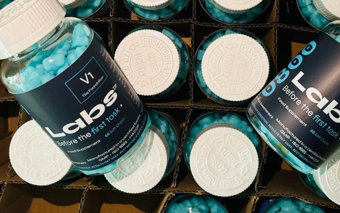 V1 gummy bottles packed in a shipping box, 0800Labs' discontinued Field Test 001 prototype.